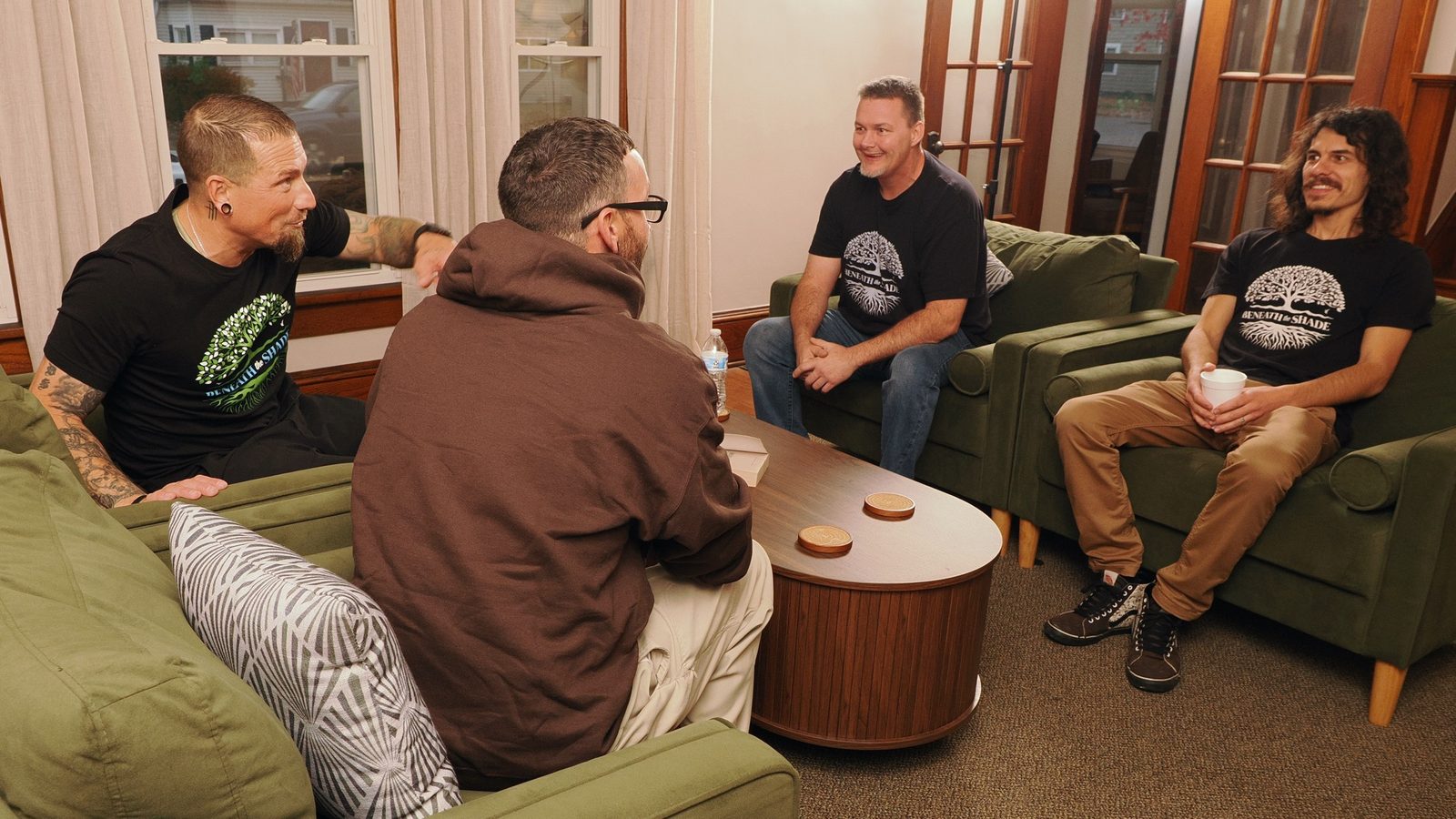 Dads talking together on couches at Jack's House of Hope